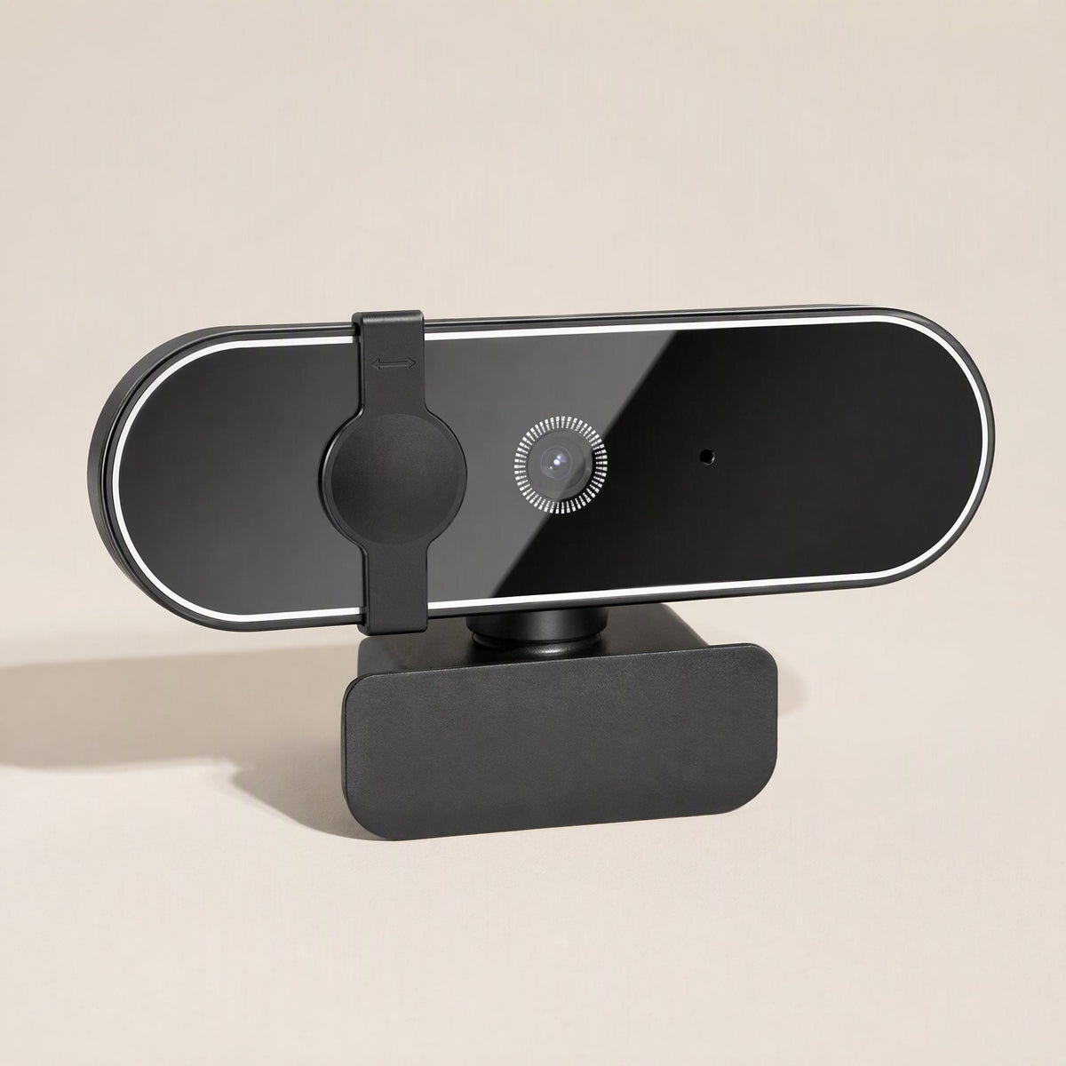 Pixelsharp – Slightly raised angle of the webcam with the privacy cover slid beside the lens, on a beige background
