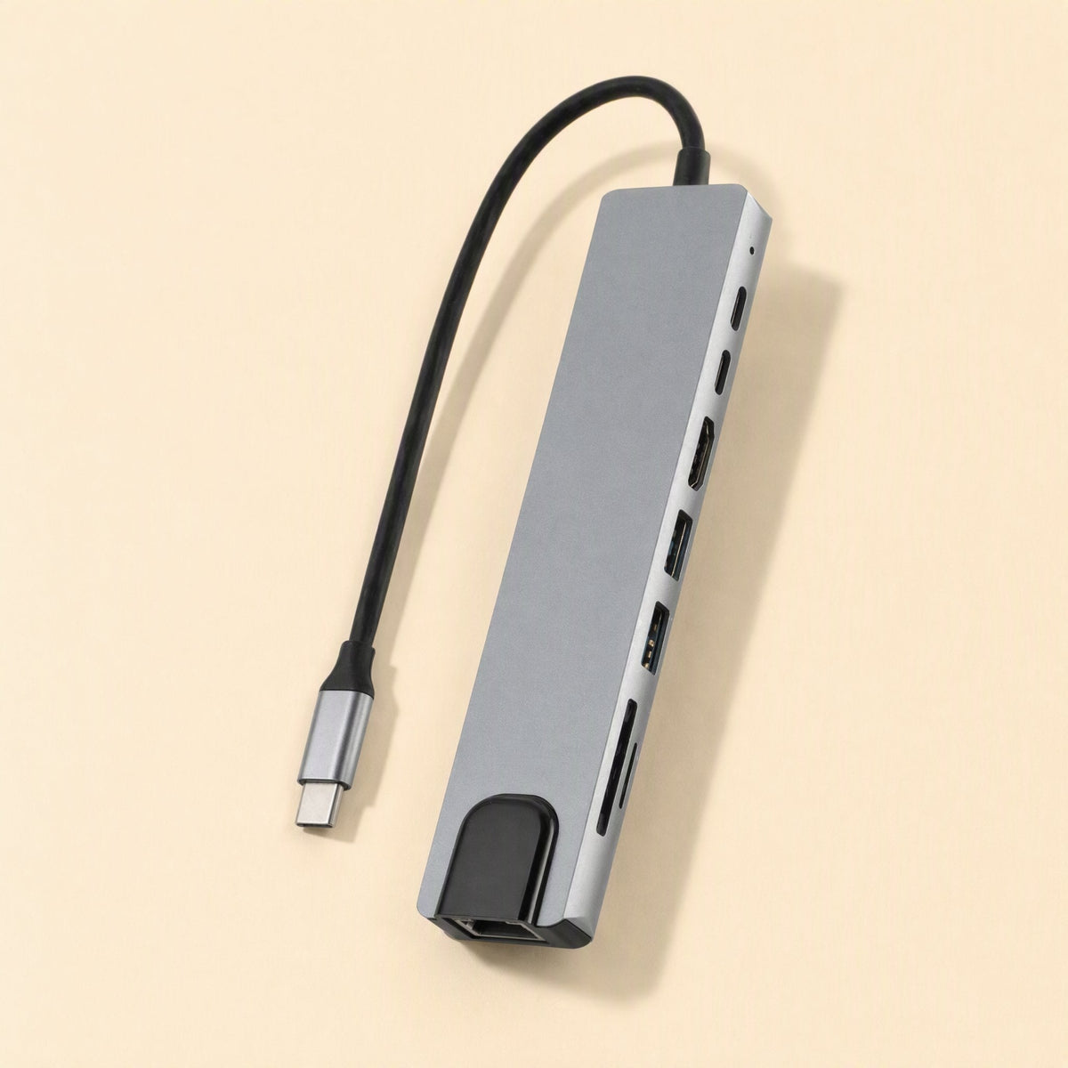 Portspan – Angled view of the gray aluminum hub showing HDMI, USB-A, USB-C and card reader ports along its side