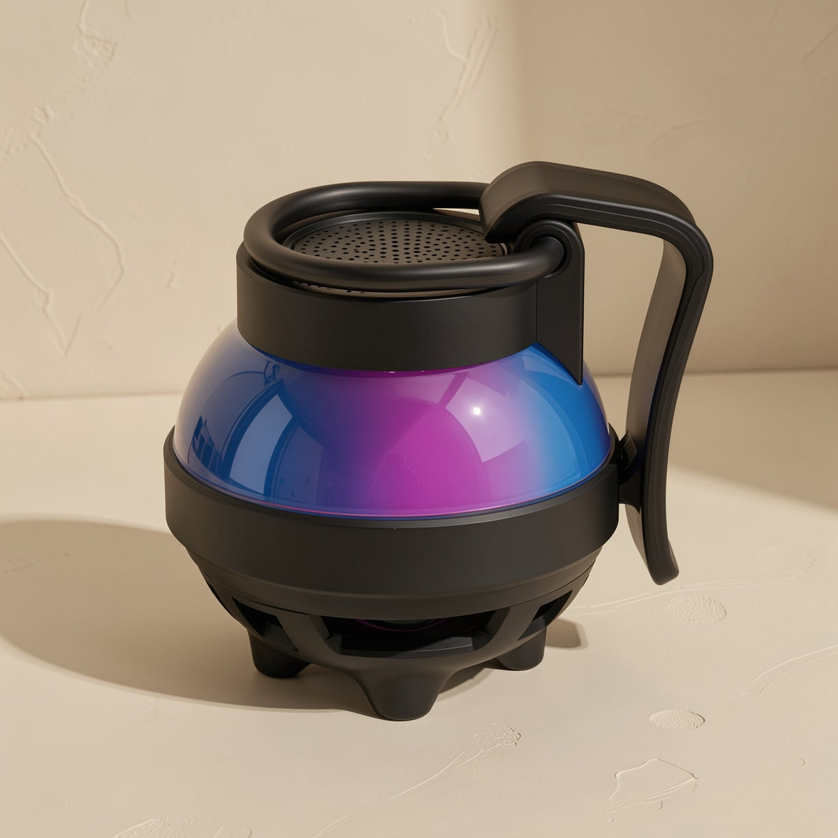 Cardchime Bluetooth Speaker – black speaker from above showing the perforated top grille and gradient blue-purple dome