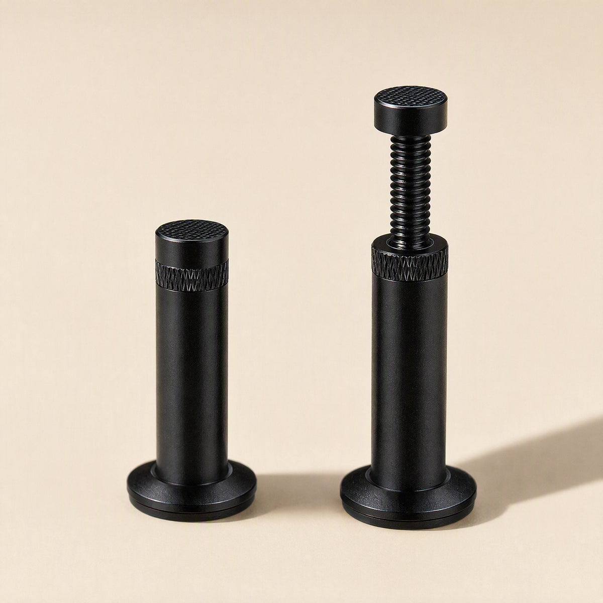Magclamp – Short fixed post beside a taller black post with extended threaded screw and flared round magnetic base