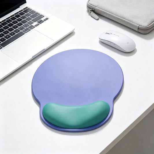 Dualhue – Purple mouse pad with green wrist rest on a white desk beside a laptop, wireless mouse and gray sleeve
