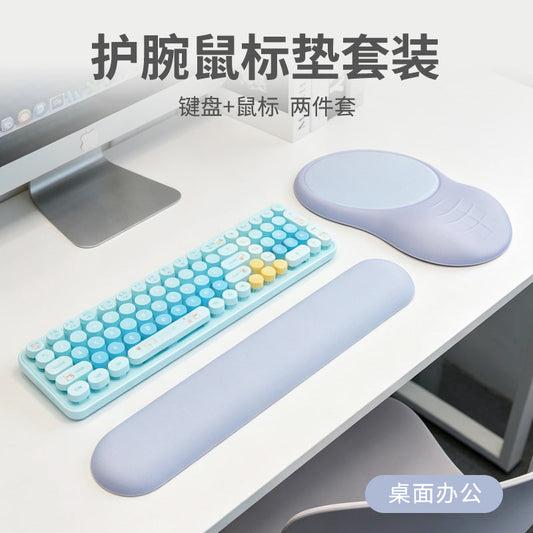 Wristmend – Lavender keyboard wrist rest and mouse pad with wrist support, placed around a blue retro-style keyboard