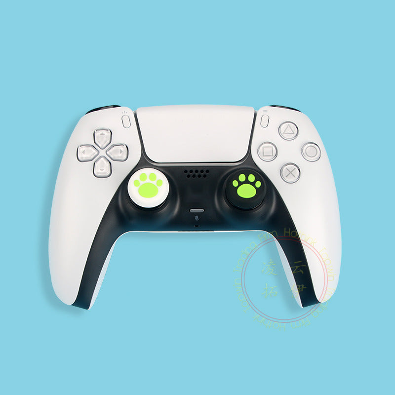 Pawgrip – White PS5 controller with lime green paw-print thumbstick caps on a white and a black base