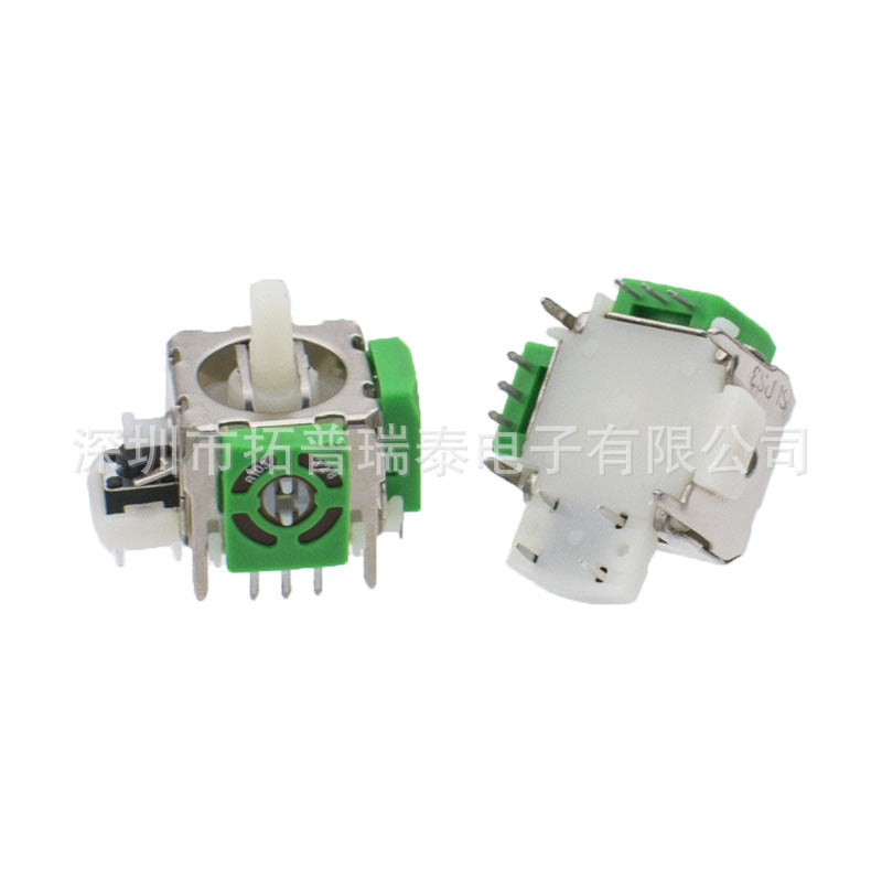 Ohmstick Joystick – green joystick module in front view with metal pins, next to a second unit tilted to show its white base
