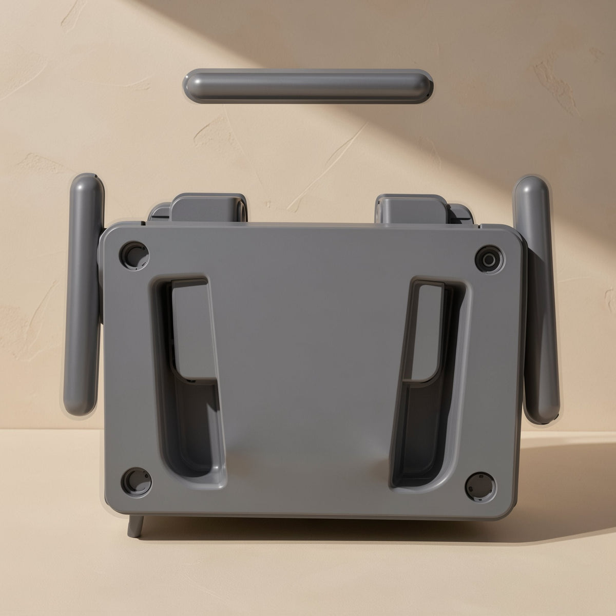 Wallpivot – Grey mount parts laid out, with a raised plate and separate side and top bars, on a beige backdrop