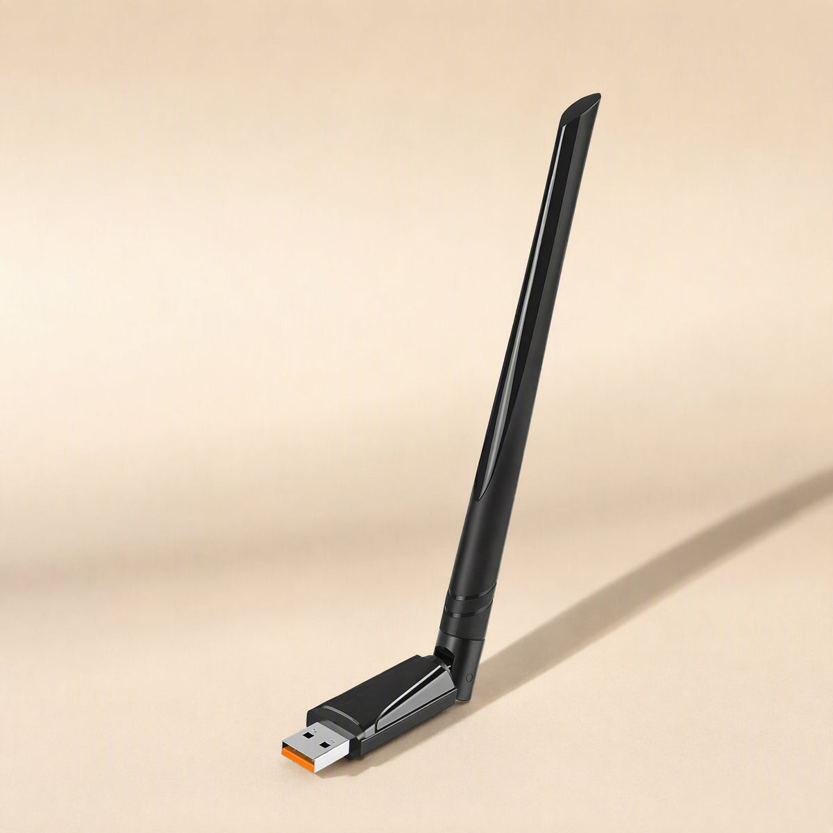 Wavebeam – Black USB wireless adapter with a tall angled antenna and an orange-tipped USB connector