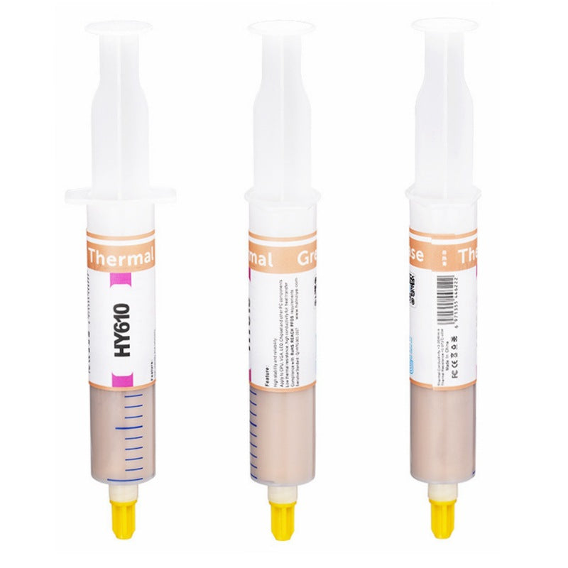 Goldglide – Three thermal paste syringes side by side showing the front, side and back of the label, yellow tips down