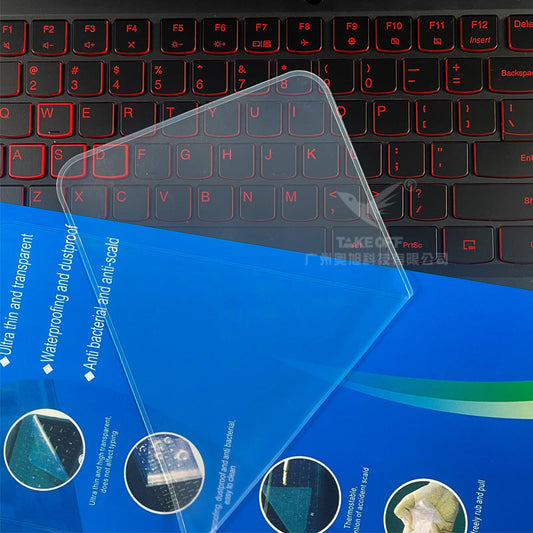 Keyfend – Clear film corner lifted off a red-backlit keyboard, with blue packaging showing product feature text