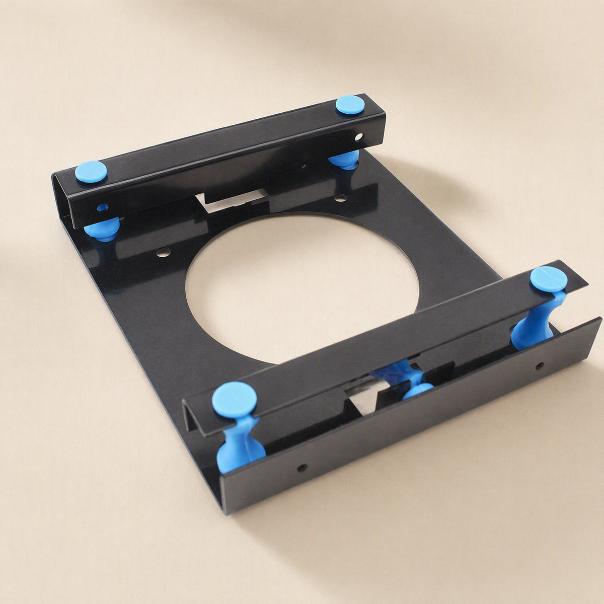 Rackshift – Black rack tilted to show its two raised side rails with blue pegs and mounting holes along the edges