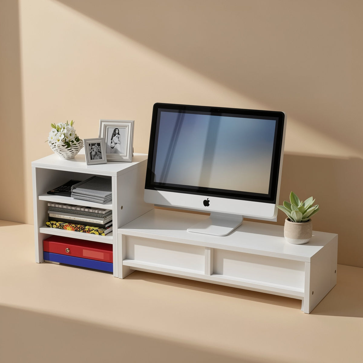 Deskledge – White two-part organizer with a monitor on the platform, a side shelf with books and photo frames, and a
