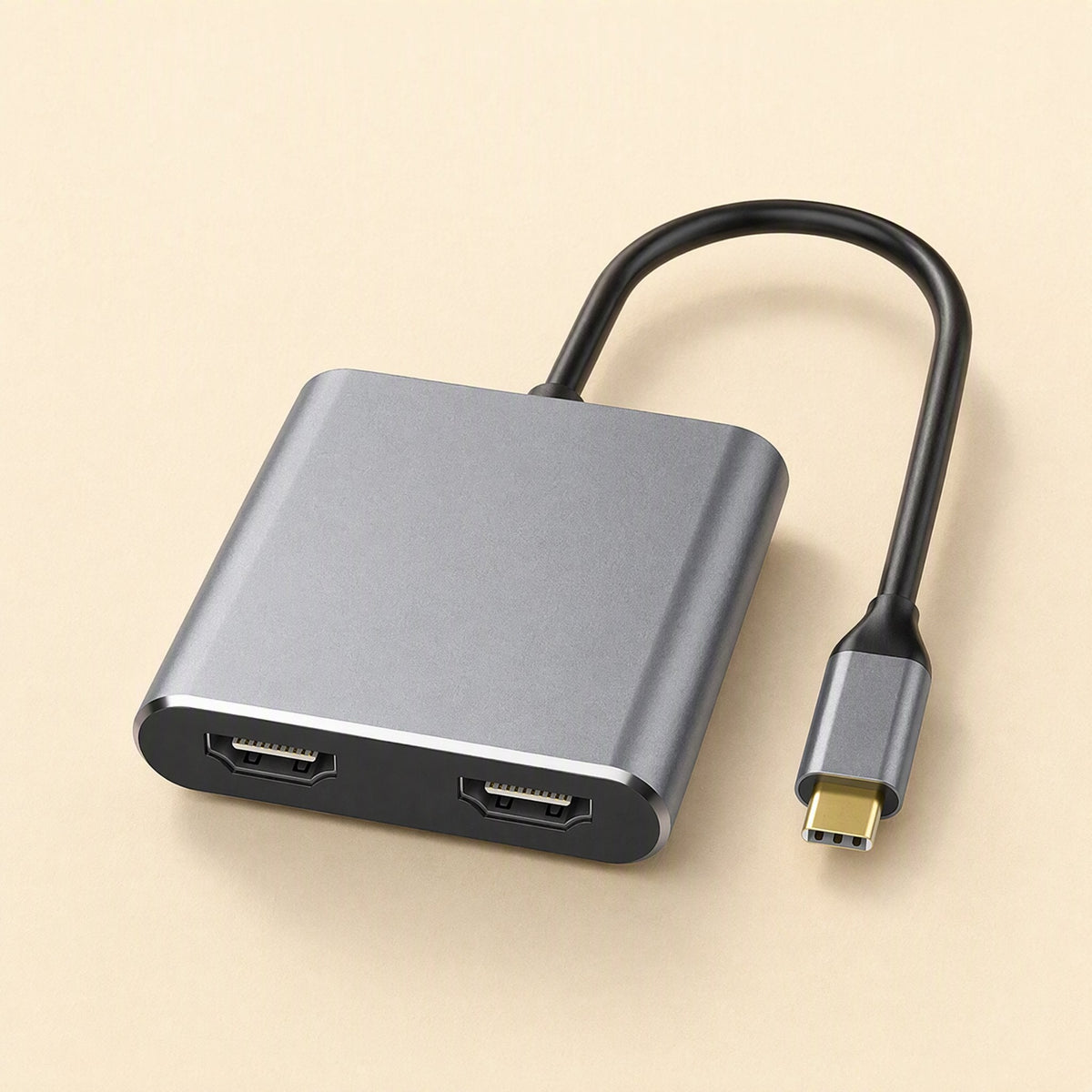 Twinview – Angled front view of gray dual HDMI docking station showing both HDMI ports and the gold-tipped USB-C connector
