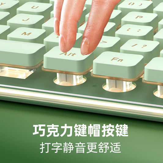 Hushkey L1 Wired Keyboard – fingertip pressing the Alt key on a mint green keyboard with round keycaps and lit gaps beneath