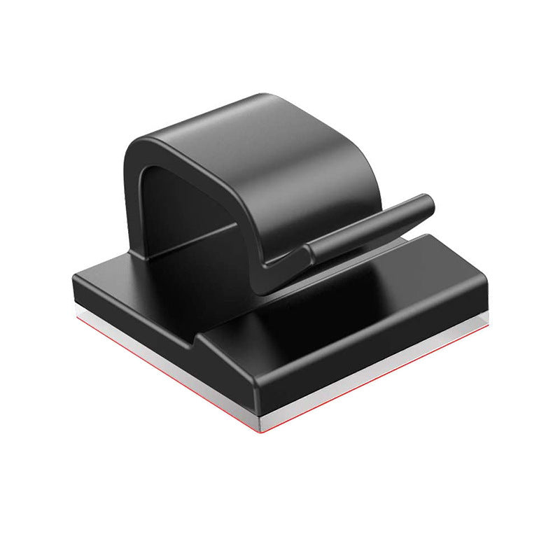 Wiretidy – Single black cable clamp at an angle, showing the open loop, release tab and adhesive base