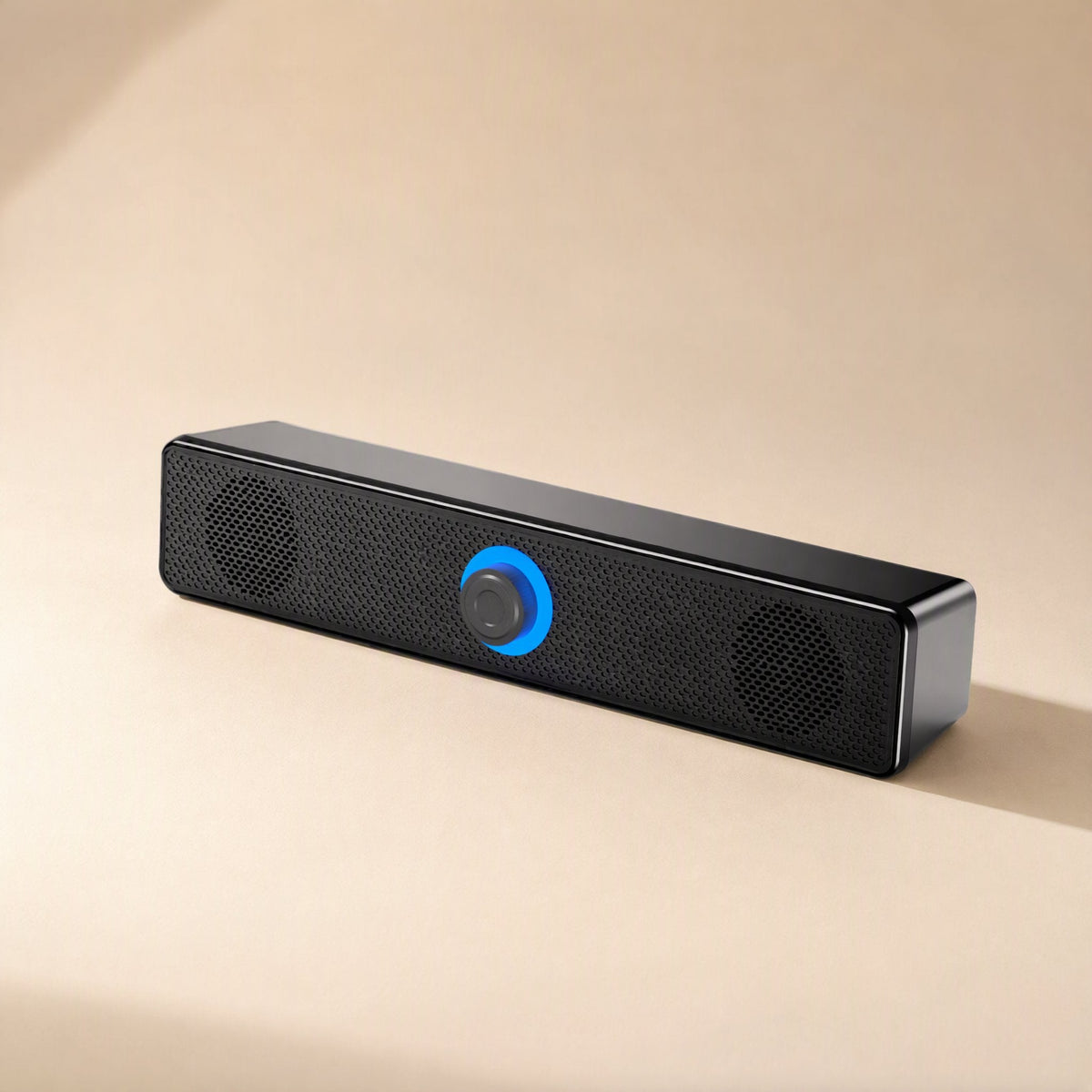 Clearbeat – Angled side view of the black speaker bar with blue light ring and metal-edged end cap