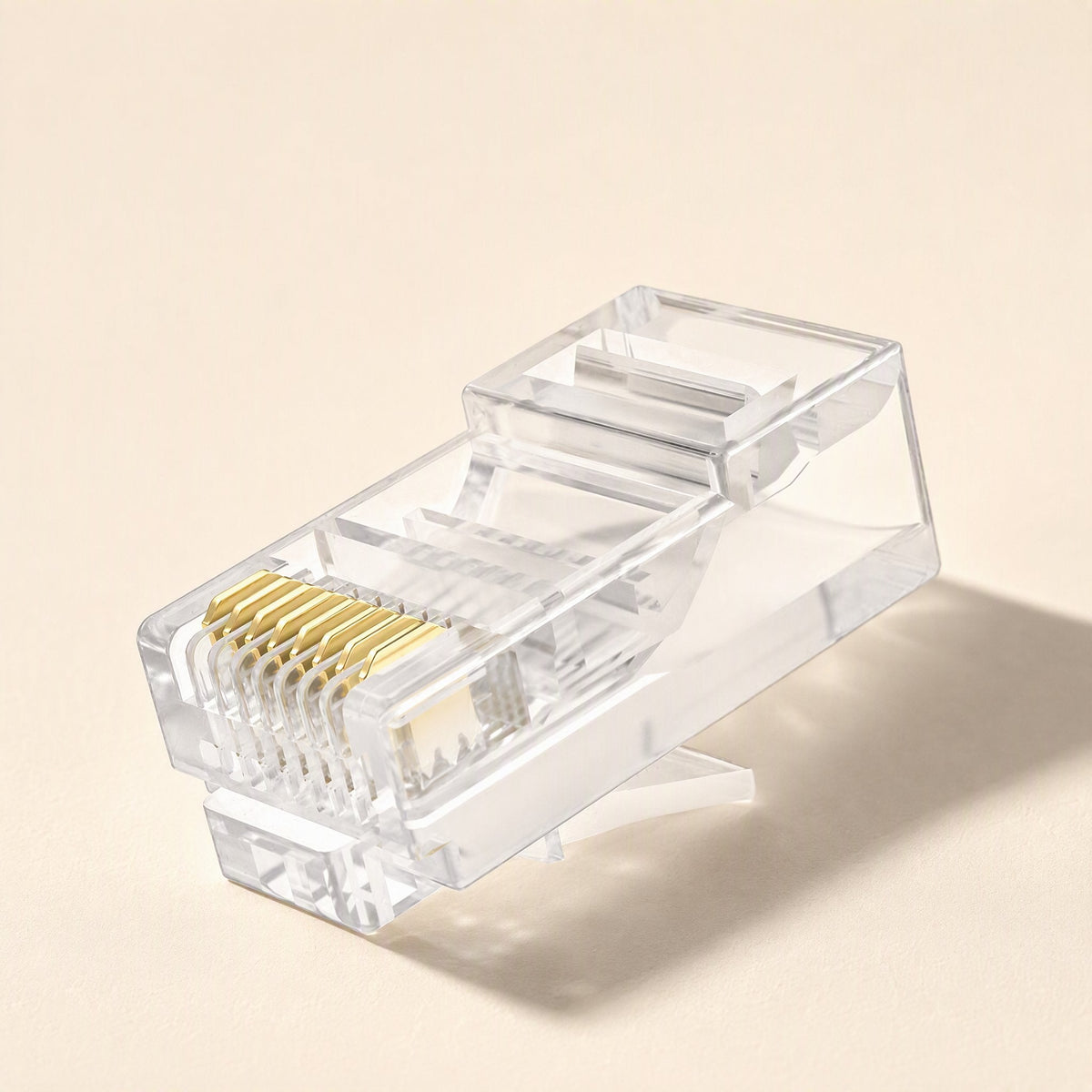 Linksnap – Single clear RJ45 plug seen from the front-side showing gold pins and the release latch below