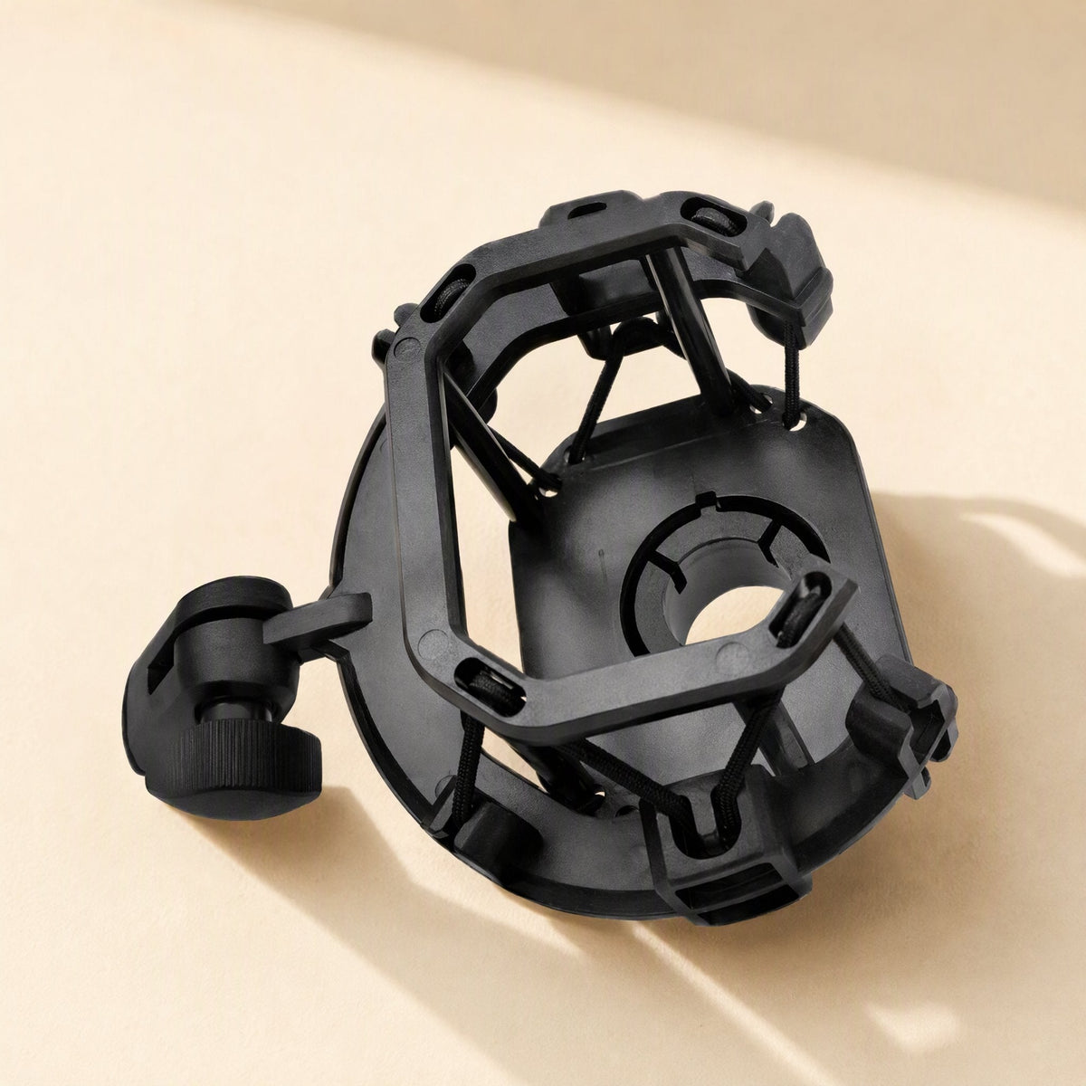 Shockgrip – Top-down angled view of a black rectangular suspension mount with side thumbscrew knob