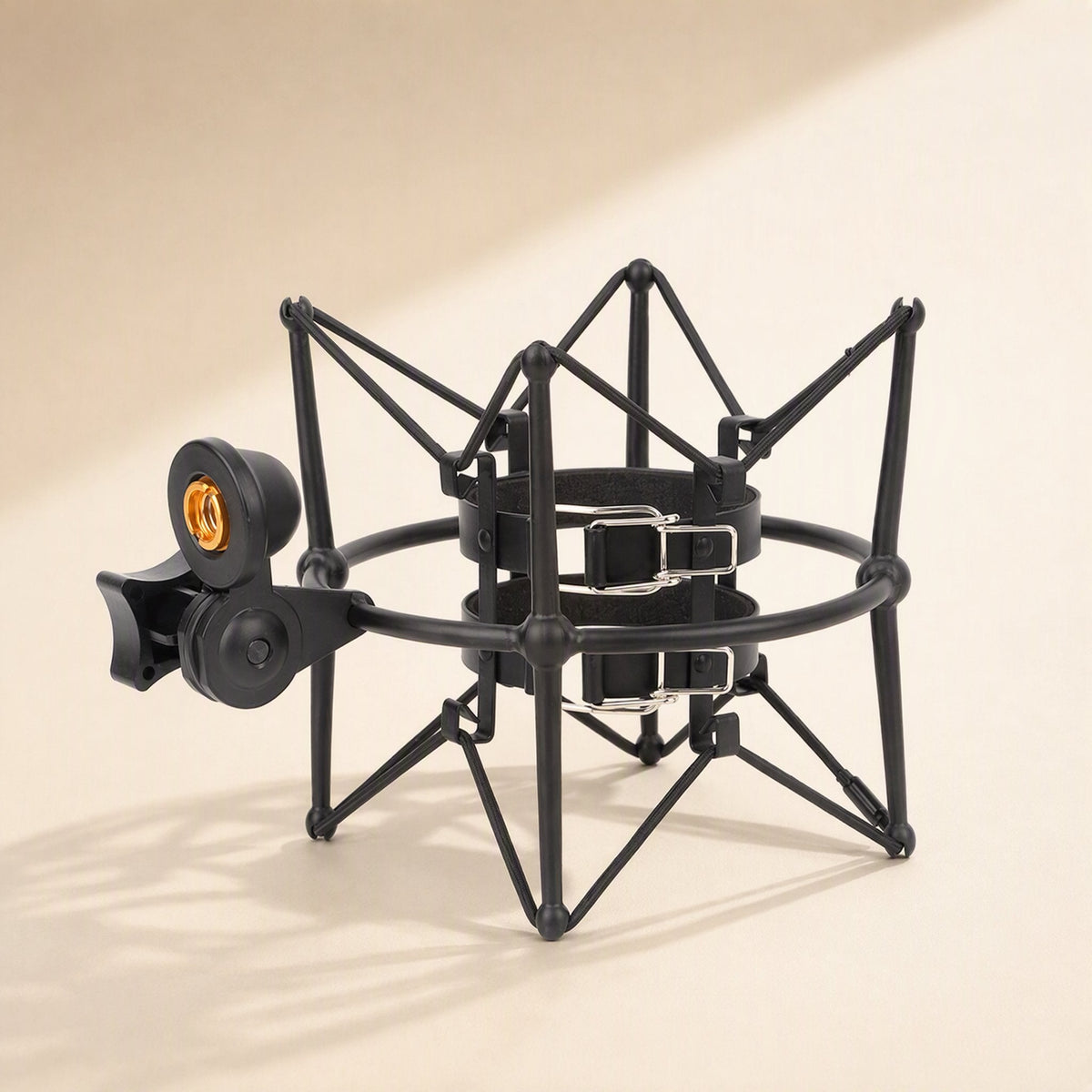 Micsteady – Black shock mount with two strap clips on the inner holder, seen from above at an angle with soft shadows
