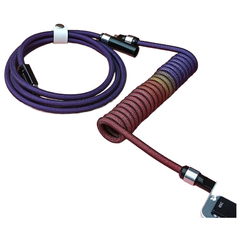 Skylink – Purple to red gradient braided coiled cable with silver aviation connector, plugged into a keyboard