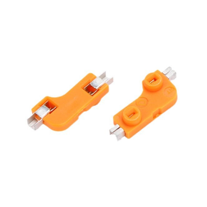 Switchwell – Pair of orange hot-swap sockets, with one turned over to show the silver metal contacts