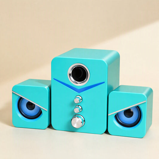 Soundbud – Teal 2.1-channel speaker trio with chrome knobs and blue glowing eye-style satellites, front view