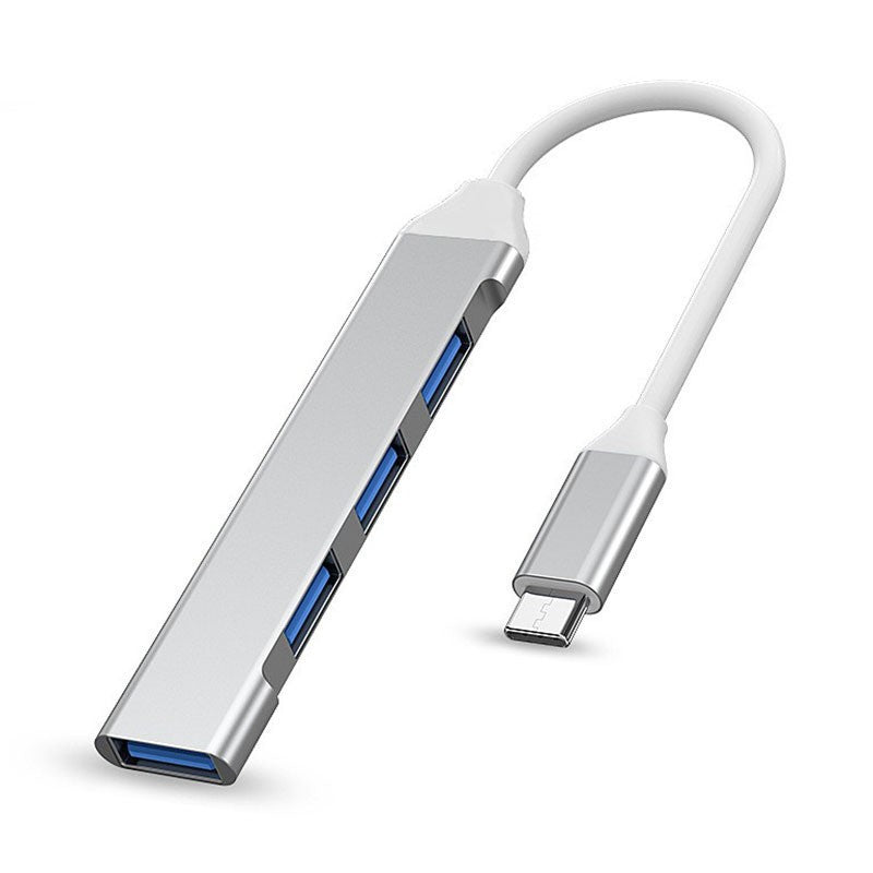 Alloyhub – Silver aluminum four-port hub with short white cable and Type-C connector on a white background