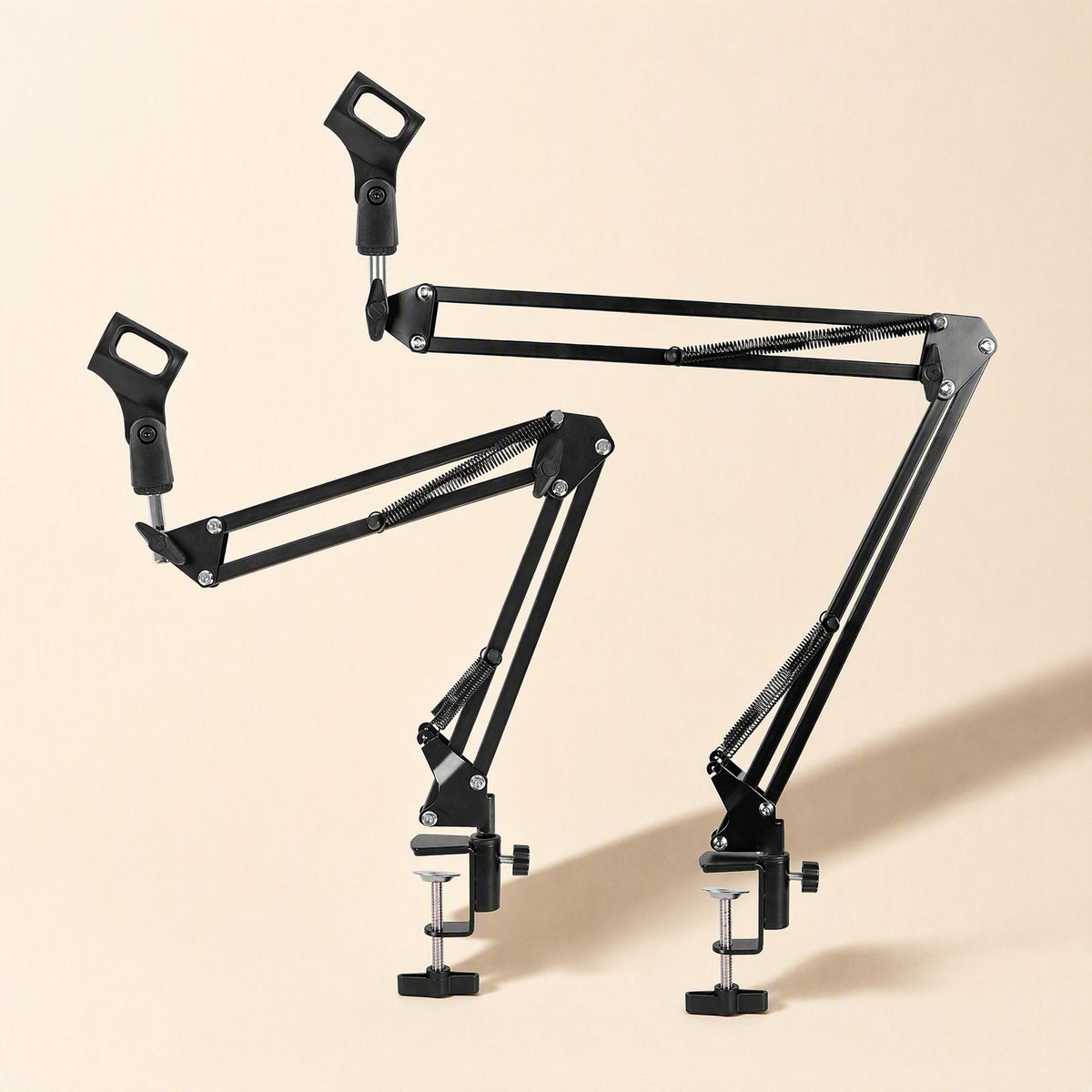 Standfold – Two black mic stands side by side, one arm extended high and one lower, each with a desk clamp