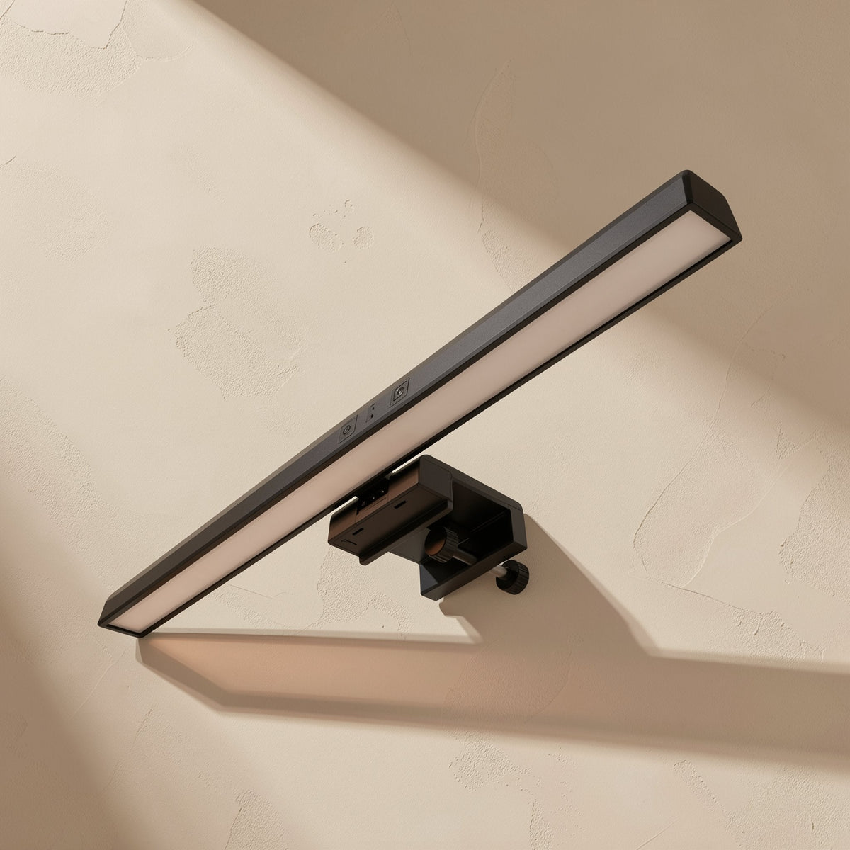 Taplume – Black screen lamp with touch controls and clamp mount, seen at an angle against a textured beige wall