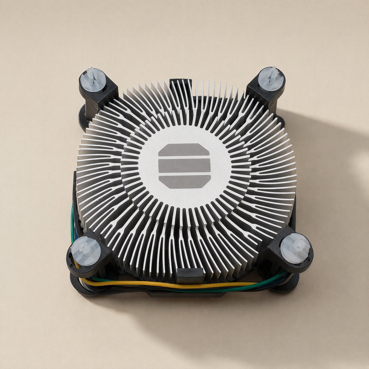 Chipbreeze – Overhead view of the radial aluminum fins around the center contact plate, with a pin at each corner