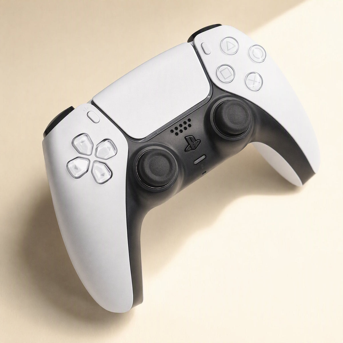 Stickgrip – White PS5 controller shown from above with black stick caps installed on both thumbsticks