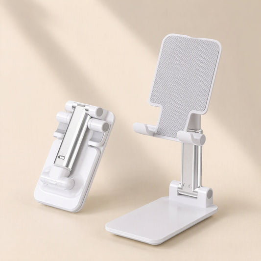 Foldangle – White folding phone stand open beside a flat folded one, showing the silver arm and textured cradle