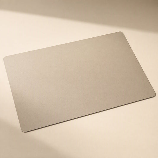 Smoothpad PU Leather Desk Mat – rectangular desk mat in light taupe with rounded corners on a cream background