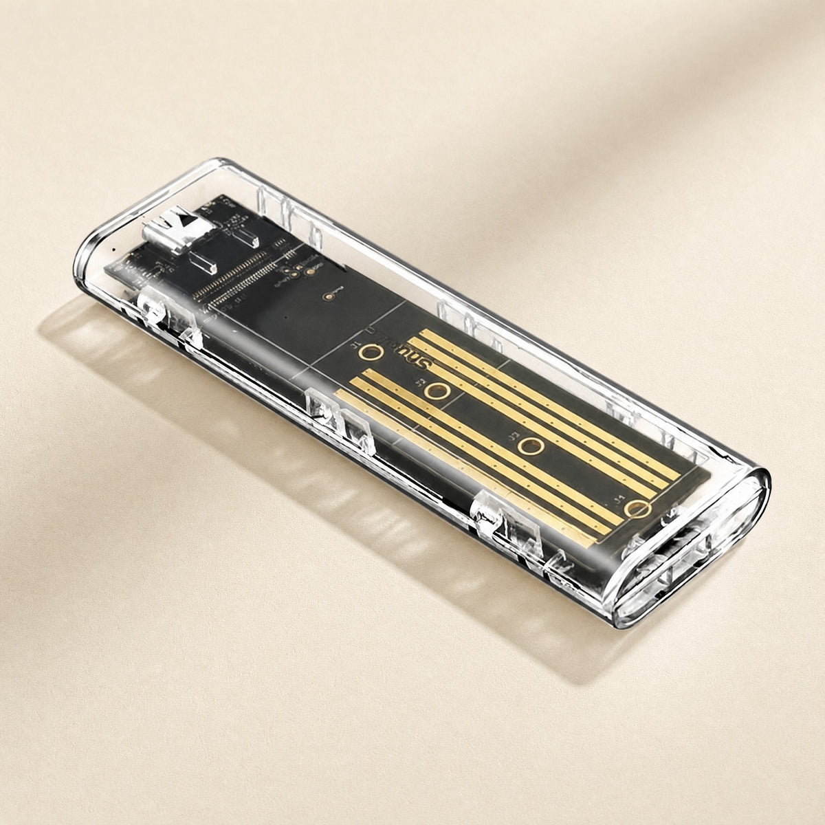 Diskhull – Angled view of the see-through case with the gold-striped board and USB-C port at the far end