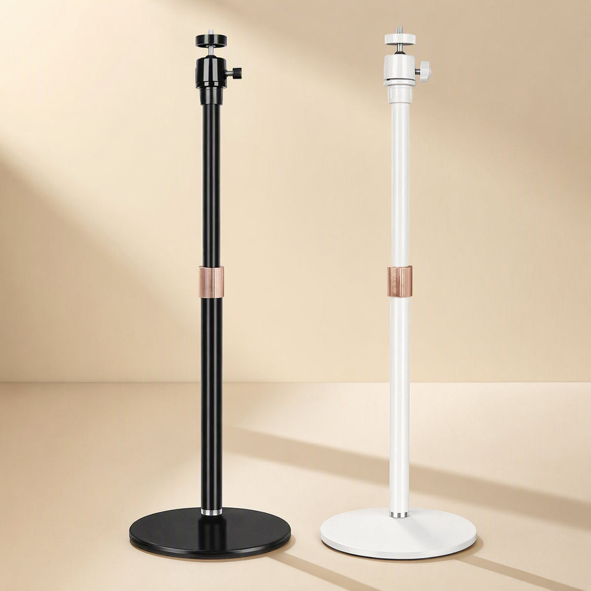 Toneanchor – Black and white stands with copper-toned locking collars on the pole, set against a warm studio background