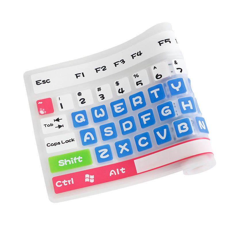 Dustshell – Close-up of a partly rolled silicone keyboard skin with blue letter keys, green Shift and pink Ctrl and Alt