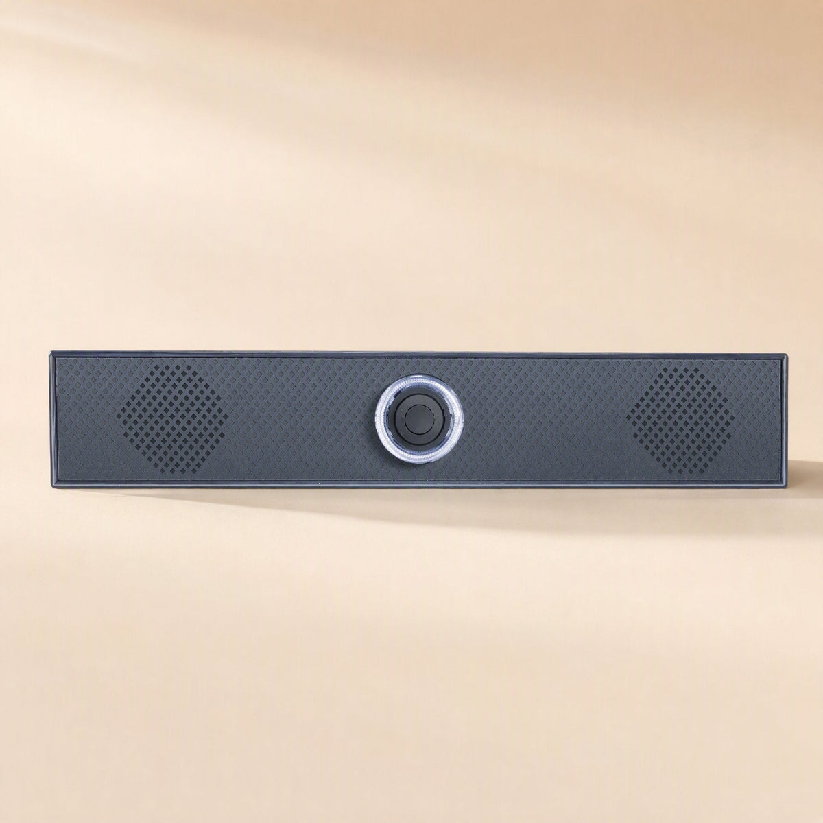 Soundbit – Front view of a dark gray soundbar with a textured mesh grille, two diamond-shaped vents and a center knob