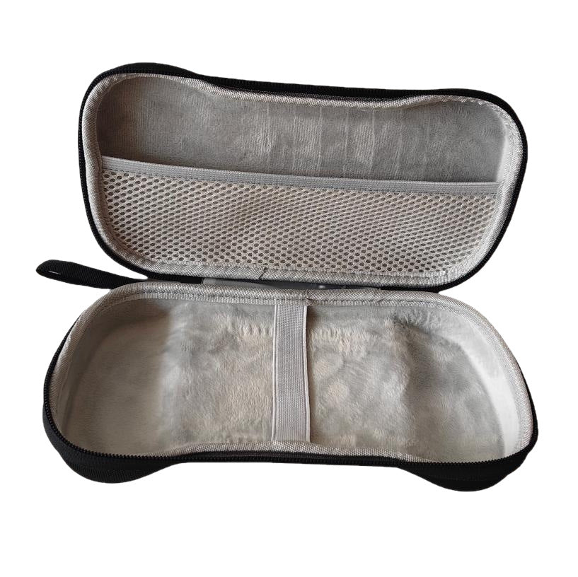 Pockette – Empty open case showing the soft grey lining, white elastic band, and mesh pocket in the lid