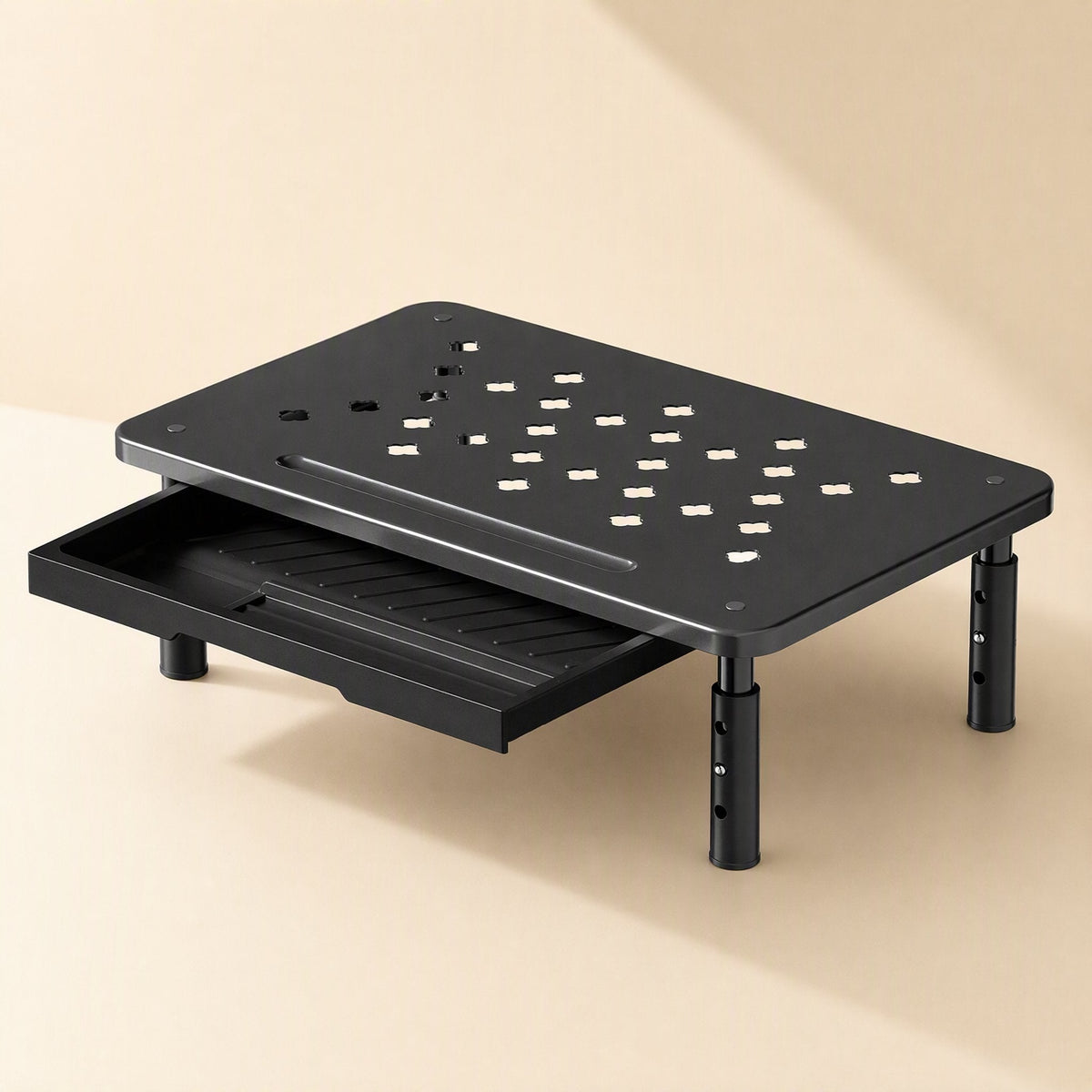 Risecrest – Black riser with the drawer pulled out, showing numbered holes on the adjustable legs and a patterned top