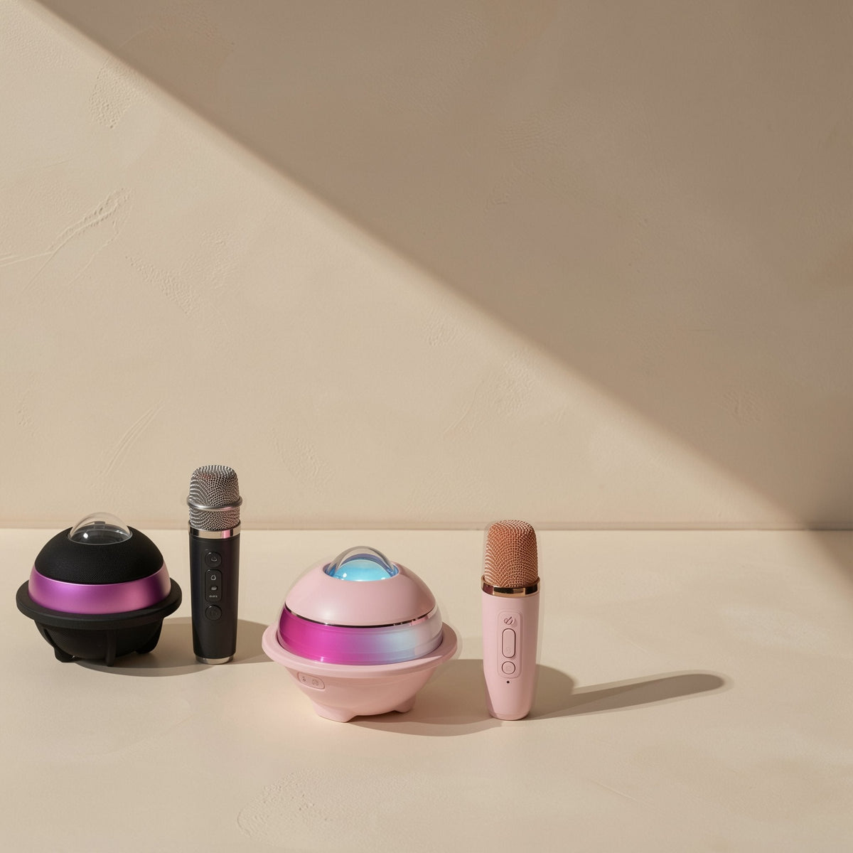 Glowchord Bluetooth Speaker – black and pink versions of the speaker, each paired with a handheld microphone, side by side
