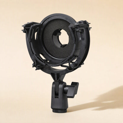 Micushion – Black round shock mount with foam-padded ring and clamp stand, front view on beige background