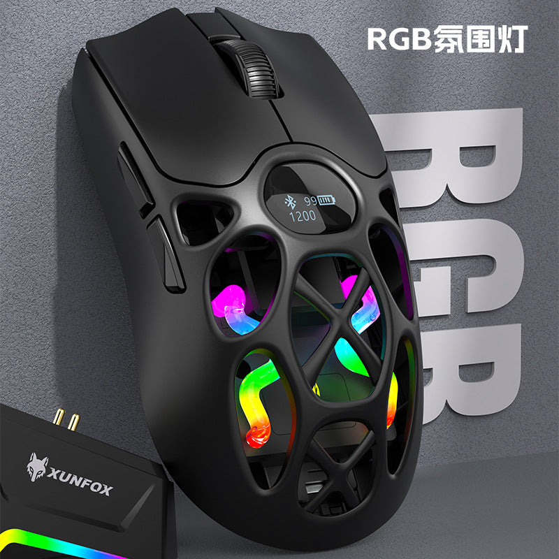 Swiftglide – Black honeycomb-shell gaming mouse close-up with small display and glowing RGB light tubes beside a charging