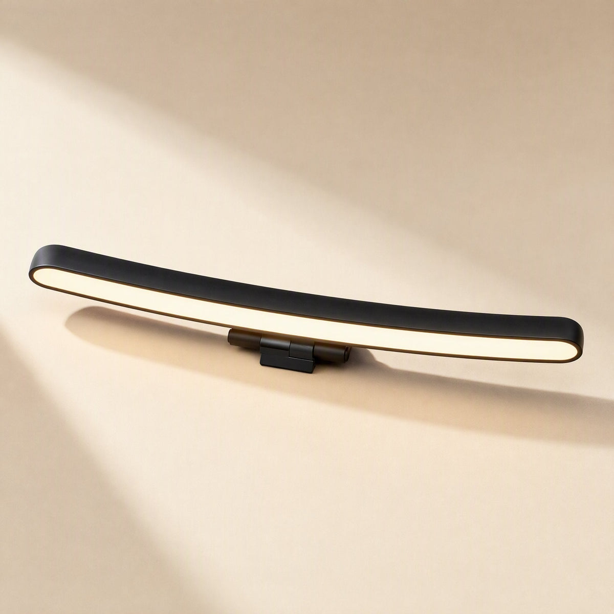 Screenhalo Curved Monitor Hanging Lamp, black curved bar with warm white light on a beige background