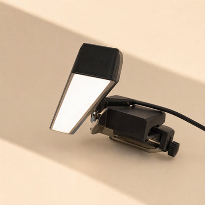 Screenlite Metal Monitor Hanging Light – close-up of the clamp and tilting lamp head with screw knob and black cable