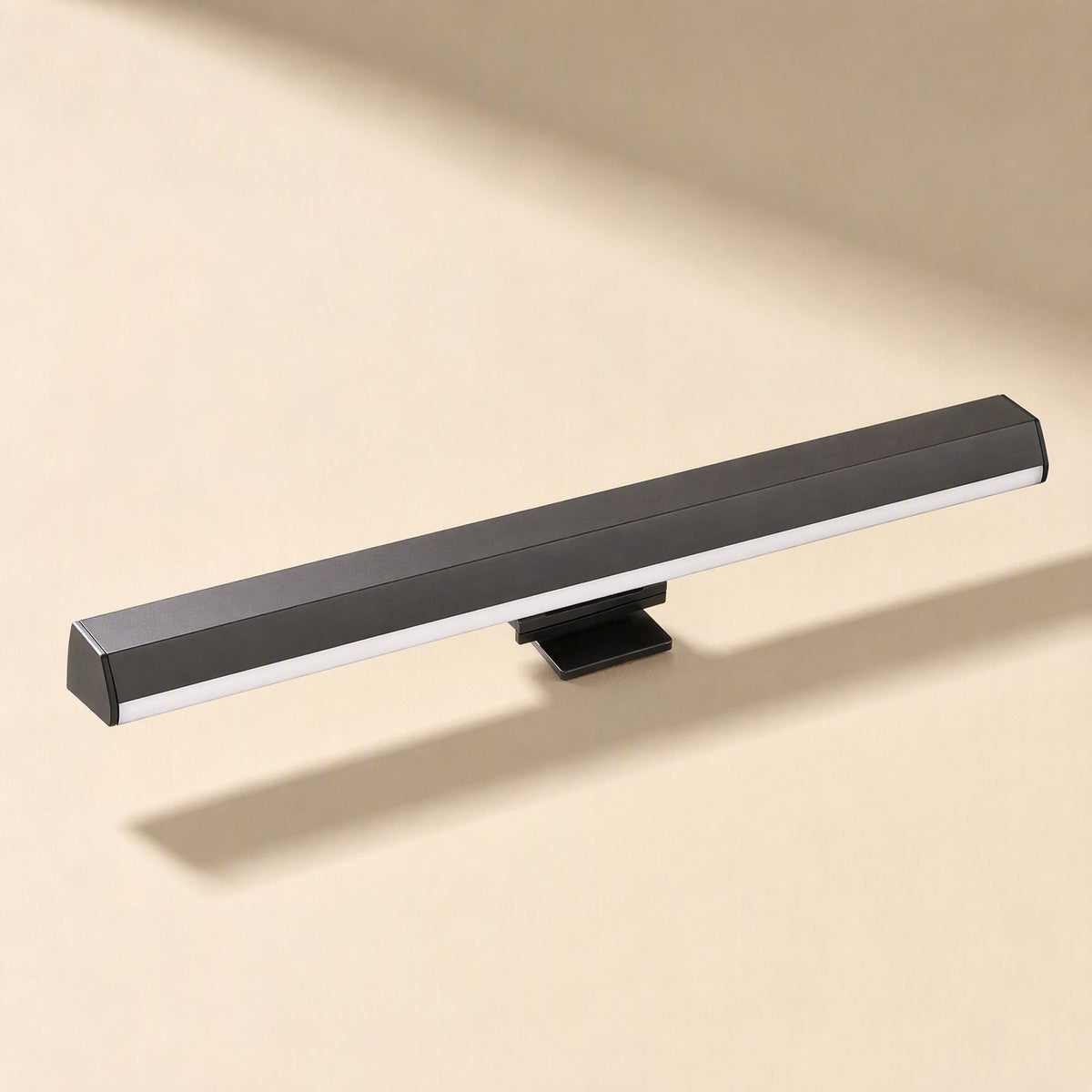 Screenlite – Black light bar with a clip mount, shown from the front against a warm beige background