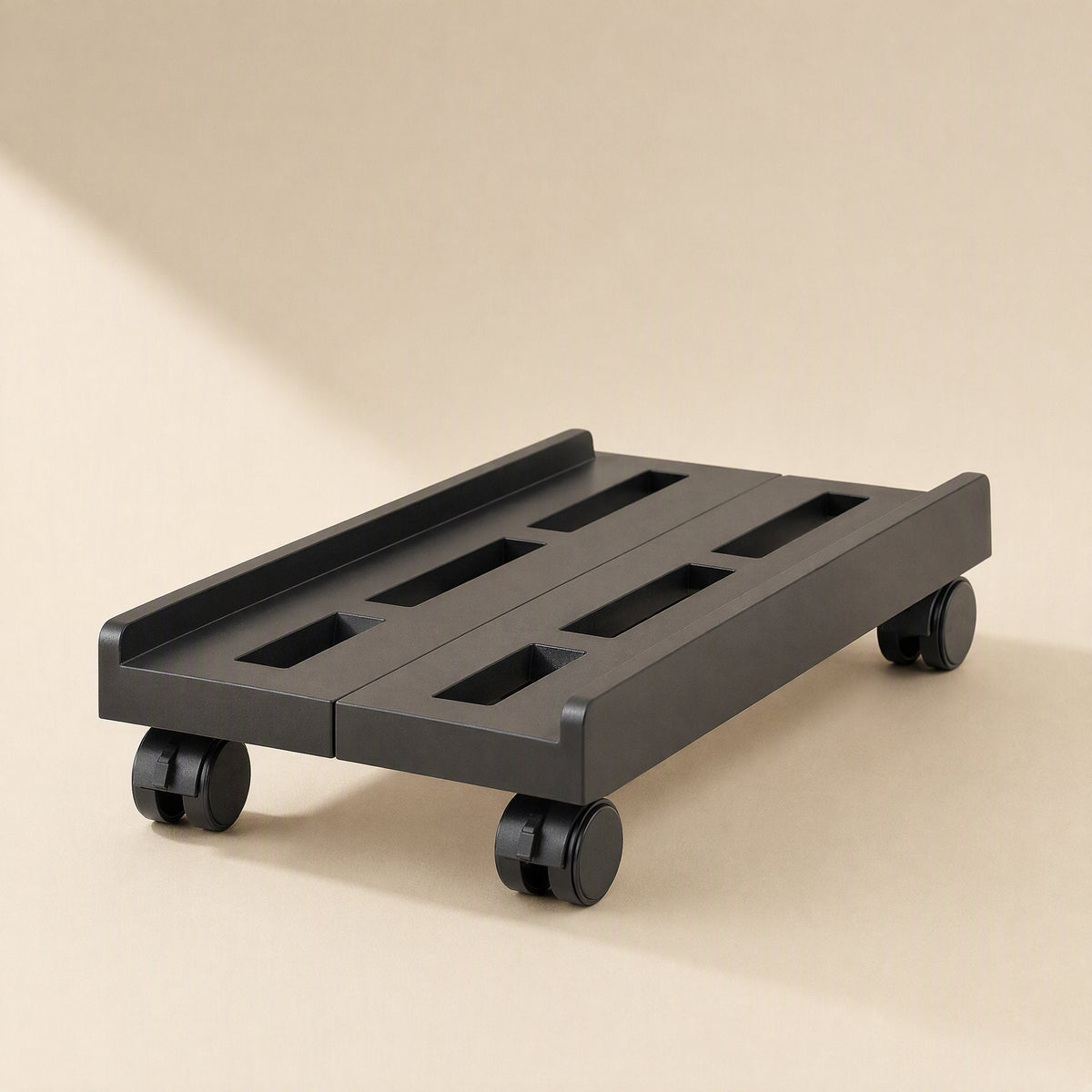 Slidecaddy – Black rack with wheels from a low front angle, showing rectangular slots and raised back edge