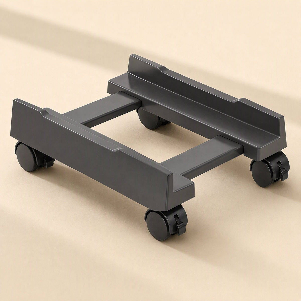 Towerbase – Grey adjustable tower stand extended wide, with side rails and crossbars visible between the wheels