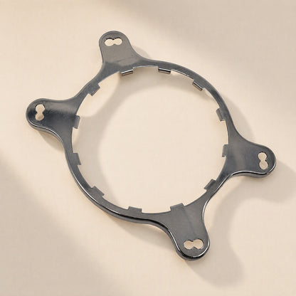 Coolmount – Angled view of the bare steel mounting ring with four keyhole slots and notched inner edge