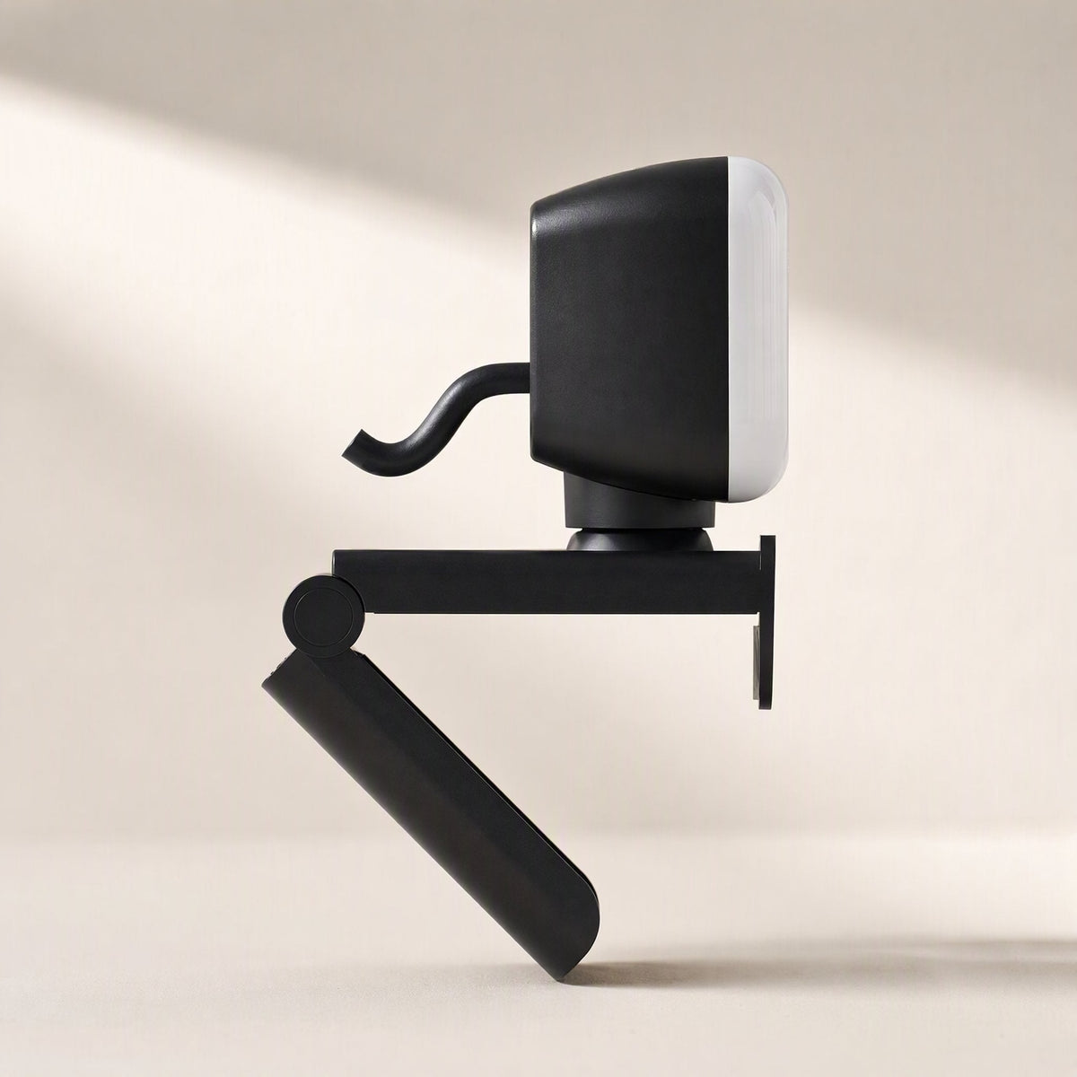 Screenface USB Computer Camera – side view of the webcam with a curved cable and folding clip stand, light panel facing right