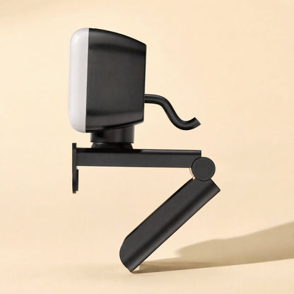 Screenface – Opposite side view of the webcam showing the folding clip arm and short cable, light panel facing left