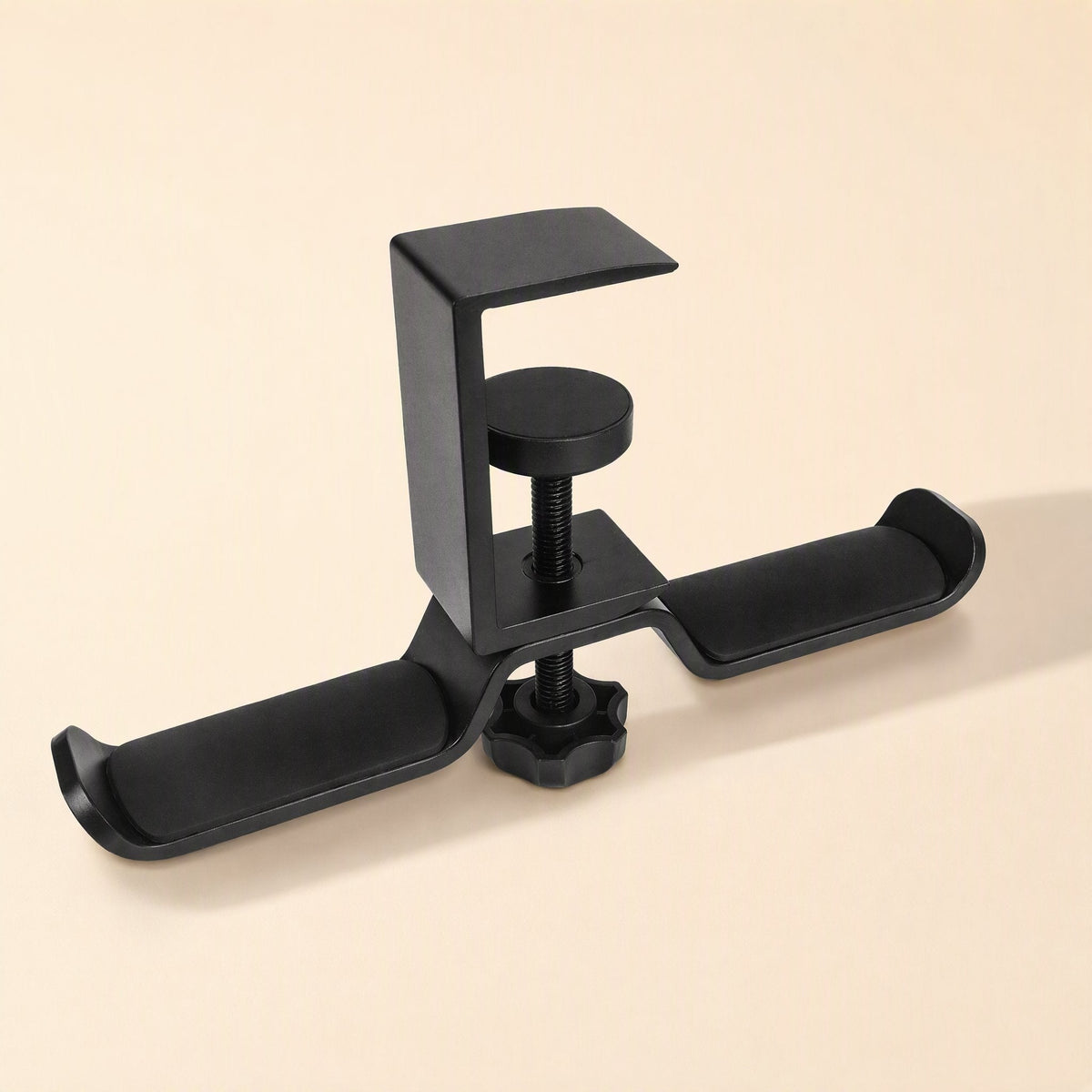 Aluturn Headphone Stand – black C-clamp stand with two padded hooks and a round tightening screw on a cream background
