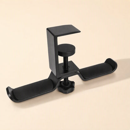 Aluturn Headphone Stand – black C-clamp stand with two padded hooks and a round tightening screw on a cream background
